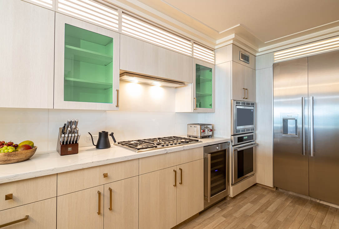 Kitchen with stove, oven, refrigerator.