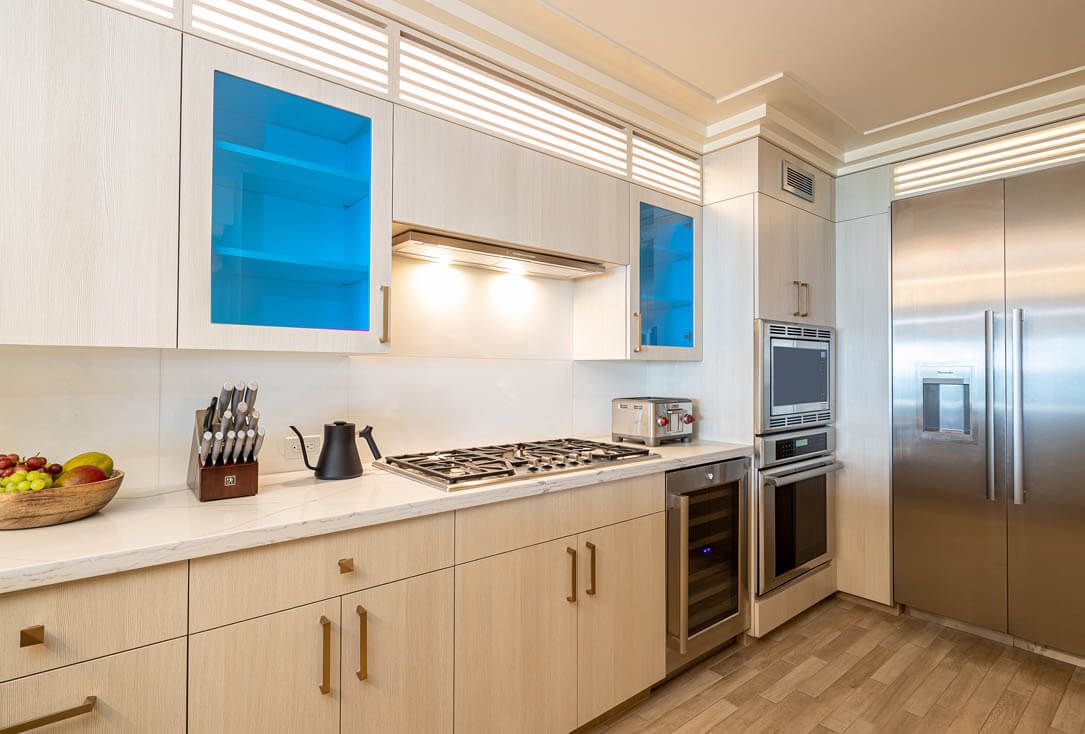 Kitchen with stove, oven, refrigerator.